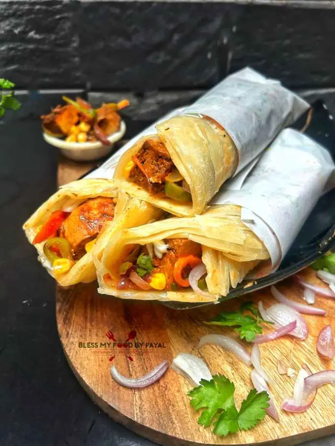 Kathi roll stuffed with spiced meat and veggies wrapped in soft paratha